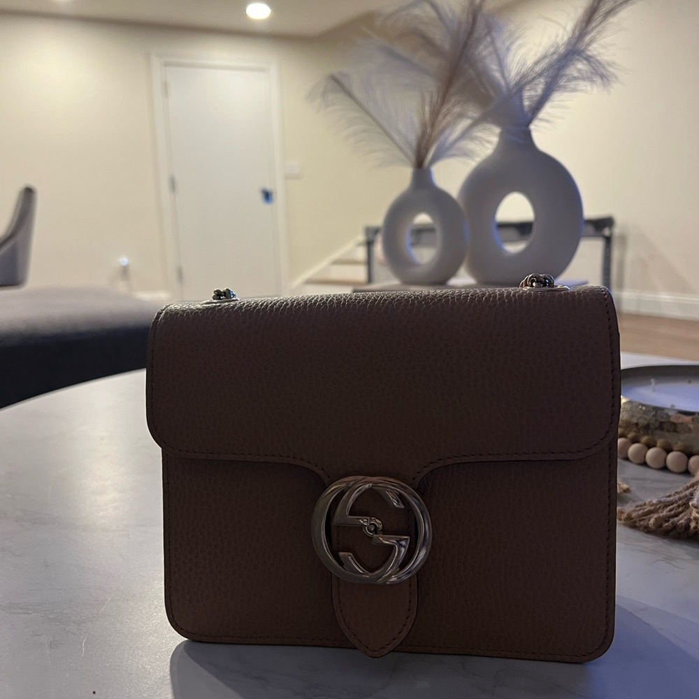 Gucci bag medium size it fits a purse and a phone